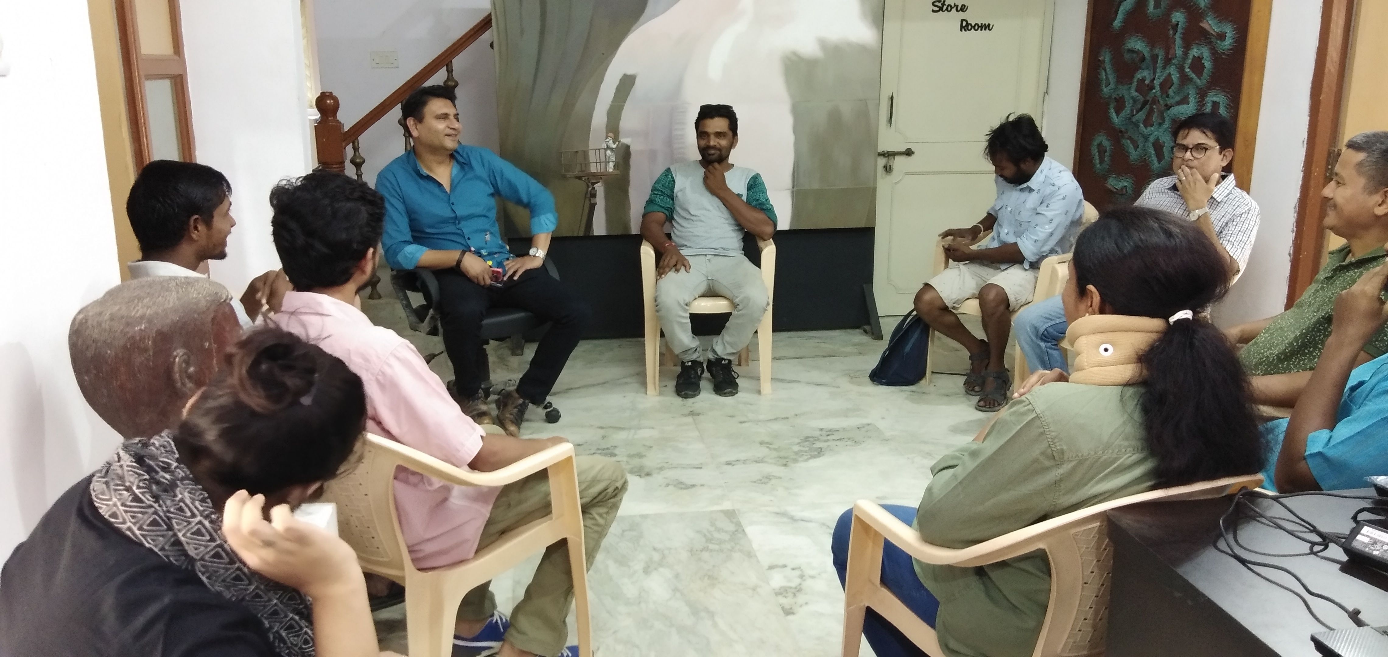 Director having interaction with studio artists