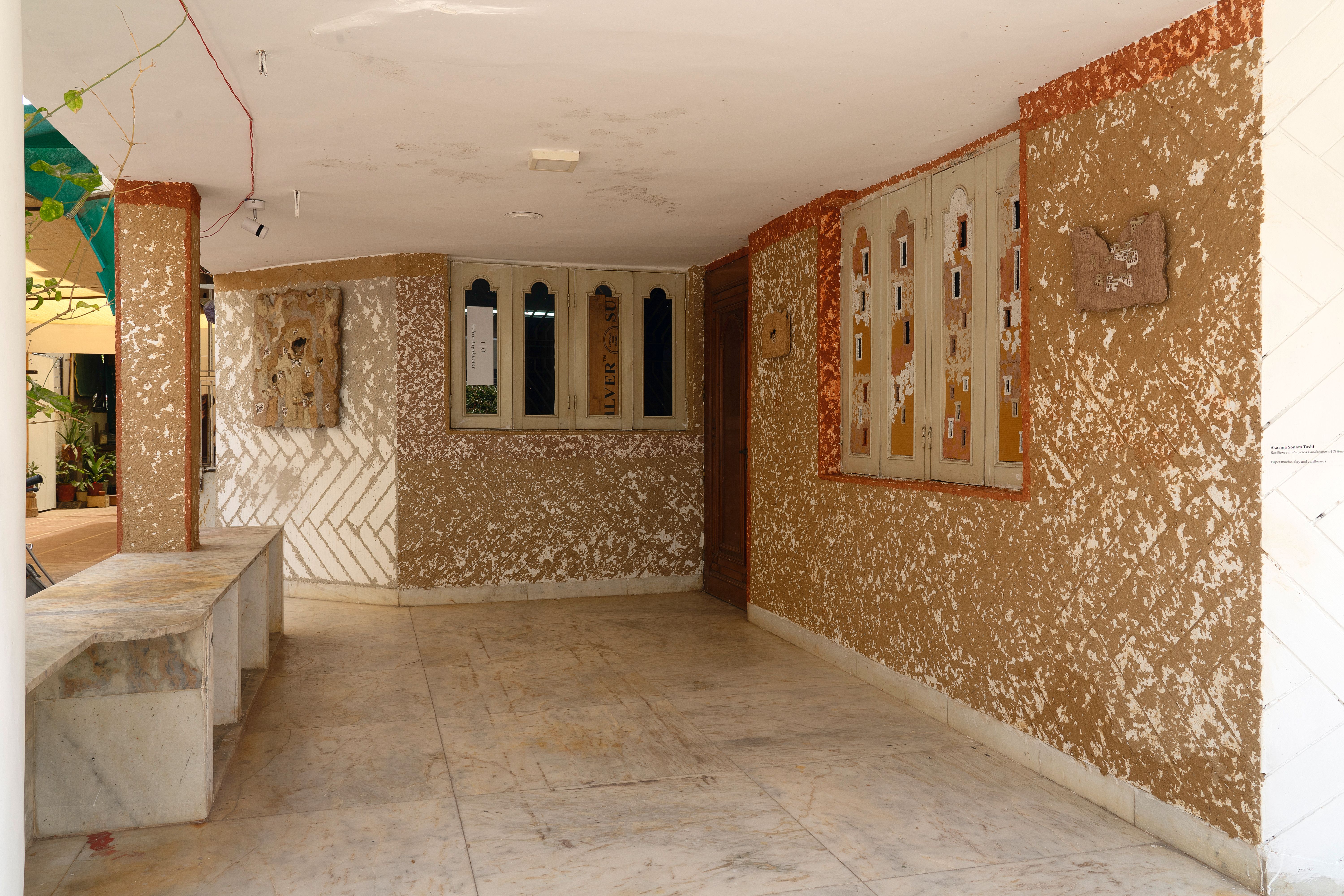 Artist-Skarma Sonam Tashi; Title- Resilience in Recycled Landscapes A tribute to Ladakh's sustainable living; Medium-Paper mache, different colour clay and cardboards